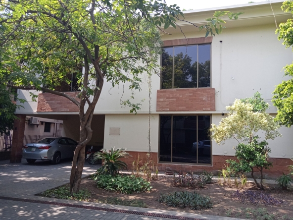 Front exterior of commercial building for rent in Upper Mall Lahore – Hamza Real Estate” “Spacious office building with parking area in Upper Mall Lahore – real estate in Lahore by Hamza Real Estate” “Modern double-story commercial property available for rent in Upper Mall Lahore – trusted real estate agency in Pakistan” “Commercial space for rent in Lahore’s Upper Mall area – Hamza Real Estate specialists in Lahore properties” “Prime location commercial building surrounded by greenery in Upper Mall Lahore – Hamza Real Estate Pakistan”